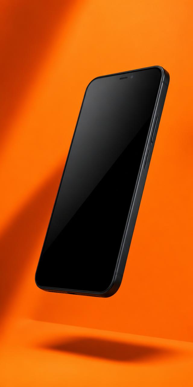 Smartphone auf orangem Studiohintergrund